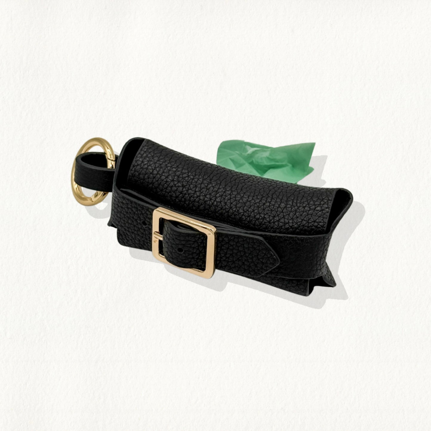 Black leather waste bag dispenser with silver hardware and buckle details.