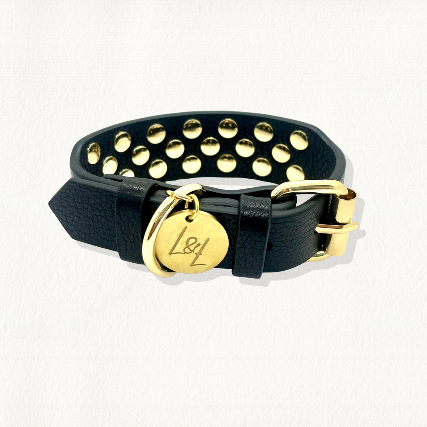 Black leather dog collar with gold studs, featuring a gold buckle closure and "L&L" logo tag.